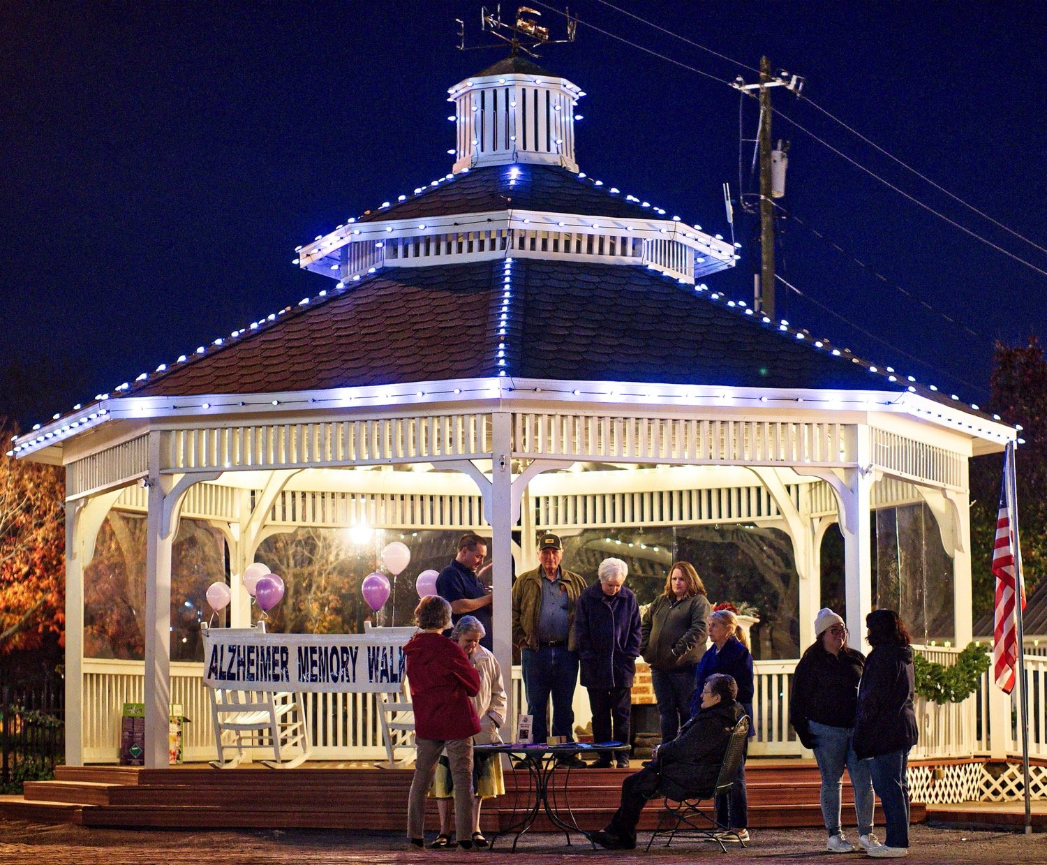 Folks gather at the gazebo in downtown Mineola for the annual event honoring those with Alzheimer's. [see the candlelight ceremony]